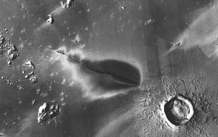 A recent explosive volcanic deposition around a crack in the Cerberus Fossae system. 