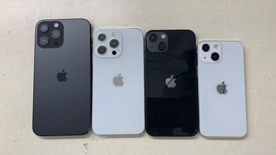 The dolls in the iPhone 13 family are smiling at the camera