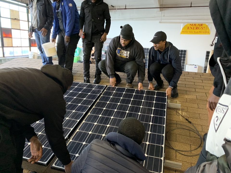 In Philadelphia, PowerCorpsPHL members receive training on installing solar panels.